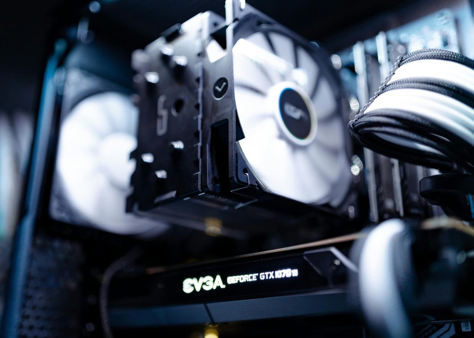 The inside of a gaming PC, its fans and graphics card lit